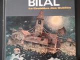 un livre sur lequel figure l'image d'un bateau sur l'eau