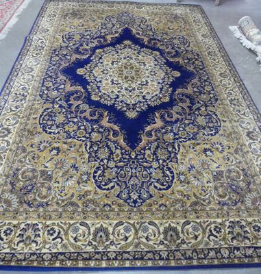 a blue and gold rug on the floor in a room
