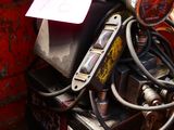 a motorcycle with a bunch of wires in the back of it