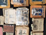 several old photos of people are displayed on a black table