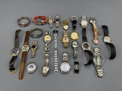 several different types of watches and bracelets on a gray surface