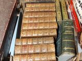 many old books on a table in a room