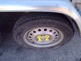 a tire with a yellow sticker on it