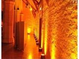a long hallway with a row of urinals in it