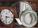 a box with a clock and a teapot inside of it