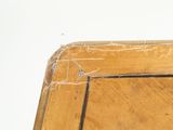 a broken piece of wood on the top of a table
