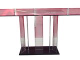 the table is made of glass and has a metal base
