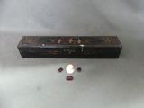 a small box with a candle inside of it on a table