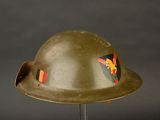 a helmet with a flag on it sitting on a stand