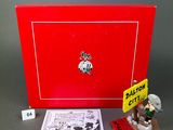 an image of a red box with a small figurine on top of it