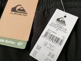 a tag on the back of a pair of black pants