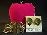 an image of a pink heart with a pair of gold earrings and a pink purse