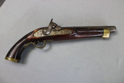 an old gun that is on display on a table