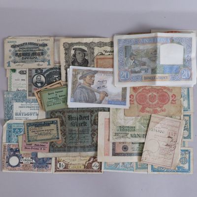 many different types of paper money on the table
