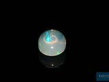 an image of a white oplite on a black surface