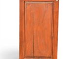 a small wooden cabinet with a door and a drawer