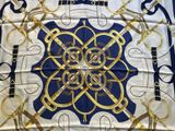 an image of a square scarf with gold and blue designs