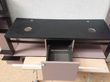 a black desk with a drawer underneath it