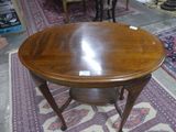 a wooden table with a glass top on a rug