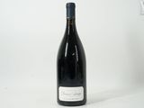 a bottle of wine that is sitting on a table
