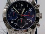 a close up of a wrist watch with a blue band