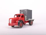 a red toy truck with a gray trailer on the back