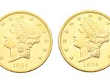a close up of two gold coins on a white background