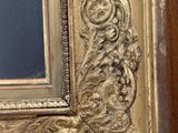 an image of a picture of a gold frame with a black background