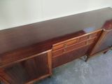 an image of a wooden sideboard with drawers and drawers