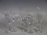 a lot of wine glasses that are sitting on a table