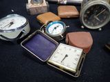 many different types of clocks on the table