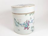 a white container with a painting on it on a white surface
