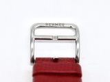 the red strap is attached to a watch with a silver buckle