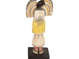 an image of a figurine of a woman with a yellow shirt