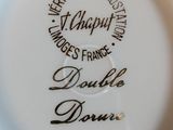a white plate with black writing on it on a table