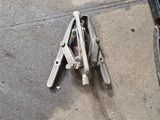 some tools are laying out on the ground next to a box