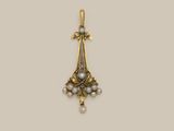 a gold and pearl pendant with a cross on it