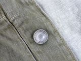 an image of a button on the back of a pair of jeans