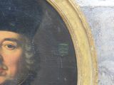 portrait of a man with a black hat and a black coat