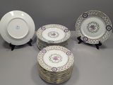 five plates on the table with a small plate in the middle