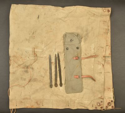 a piece of cloth with a pair of scissors on it