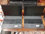 two laptops that are sitting on a table
