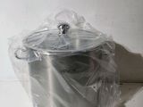 a silver pot wrapped in plastic sitting on a counter