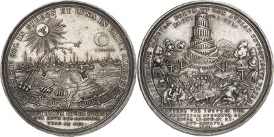 two silver coins with a picture of a castle and a town on them