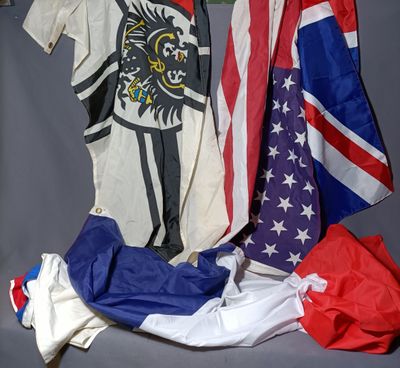 a pile of american and british flags on a table