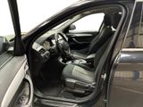 the interior of a car with the door open and the driver ' s seat down