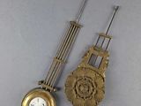 two clocks that are sitting side by side on a table