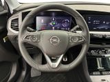 the interior of a car with a steering wheel and dashboard controls