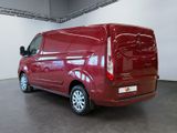 a picture of a red van parked inside of a building