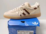 a pair of adidas sneakers are sitting on top of a box
